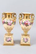 A PAIR OF PARIS EMPIRE PORCELAIN URN SHAPED TWIN HANDLED VASES ON PLINTH BASES, with swan shape