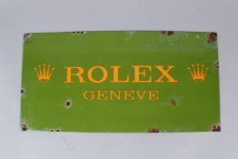 AN ENAMEL ROLEX SIGN. 16cms x 23cms.