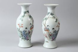 A PAIR OF 20TH CENTURY CHINESE PORCELAIN BALUSTER SHAPED VASES, painted with female figures in a