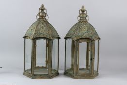 A PAIR OF VERDIGRIS PATINATED FILIGREE METAL HEXAGONAL SHAPE LANTERNS. 48cms high.