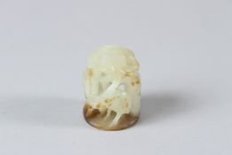 A CHINESE OPENWORK JADE, carved with lotus, pine and cranes. 3cms.