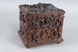 A VERY GOOD, POSSIBLY BLACK FOREST, CARVED WOOD BOX AND COVER, fitted with four gilded glass scent