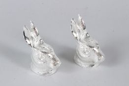 A PAIR OF PLATED HARE'S HEAD SALT AND PEPPERS. 7cms high.