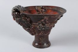 A CHINESE BUFFALO HORN LIBATION CUP. 13cms high.