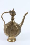 A FINE 19TH CENTURY INDIAN ENGRAVED BRASS EWER. 27cms high.