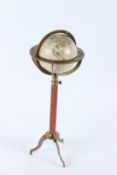 A GLOBE ON A TRIPOD BASE. 40cms high.