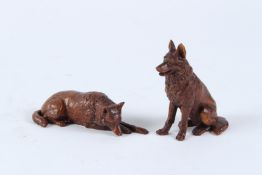 TWO CARVED HARDWOOD DOGS. 7cms.