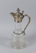 A GOOD GILT AND ETCHED GLASS CLARET JUG with continental silver mounts. 33cms high.