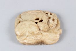 A CHINESE CARVED AND PIERCED HARDSTONE TABLET depicting fruit. 8cms wide.
