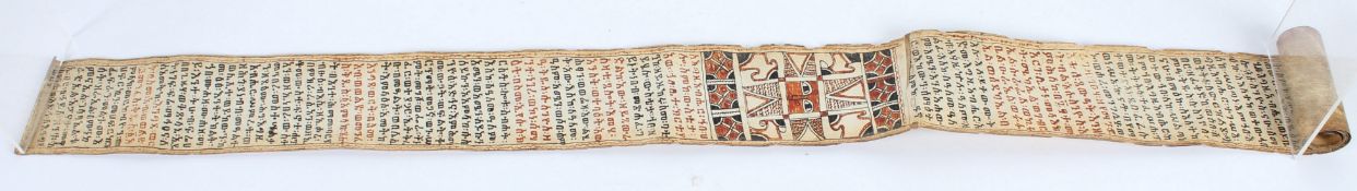 A 19TH CENTURY ETHIOPIAN CALLIGRAPHIC SCROLL. 178cms high x 8cms wide.