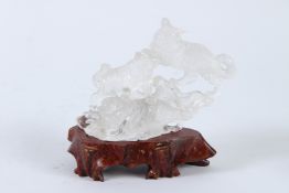 A GOOD CHINESE ROCK CRYSTAL GROUP OF THE TIGERS. 14cms long, on a wooden base.