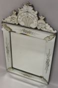 A VENETIAN STYLE RECTANGULAR WALL MIRROR, with decorative cresting. 104cms high x 62cms wide.