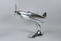 A LARGE ALUMINIUM MODEL OF A SPITFIRE. 50cms long.