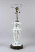 A BOHEMIAN WHITE OPAQUE GLASS VASE SHAPED TABLE LAMP, painted with roses. 73cms high incl. light