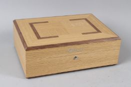 A GOOD CHOPARD OAK AND WALNUT INLAID JEWELLERY AND WATCH BOX, with original outer box and paperwork.