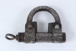AN ISLAMIC GOLD AND SILVER INLAY PADLOCK. 20cms wide.