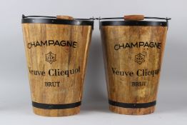 A PAIR OF METAL BOUND WOOD CHAMPAGNE BUCKETS. 40cms high.