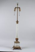 A CLASSICAL STYLE CUT GLASS AND ORMOLU COLUMN TABLE LAMP, with claw feet. 97cms high.