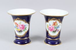 A GOOD PAIR OF MEISSEN PORCELAIN TRUMPET SHAPE VASES, rich blue ground, each painted with panels