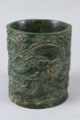 A CHINESE CARVED JADE BRUSHPOT. 15cms high.