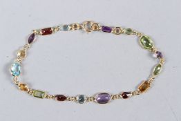 AN 18CT YELLOW GOLD MULTI-GEM SET BRACELET.