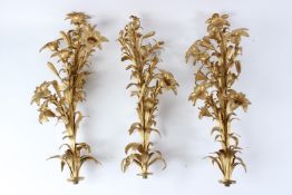A SET OF THREE ORMOLU MOUNTS, each of naturalistic form, with flowers and leaves. 27cms high.