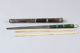 A JAPANESE SET OF KNIFE AND A PAIR OF BONE CHOPSTICKS, in a horn and silver mounted metal sheath.