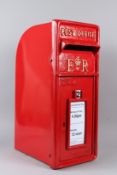 A REPRODUCTION RED PAINTED CAST IRON POST BOX. 59cms high.