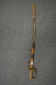 A naval short sword with scabbard.