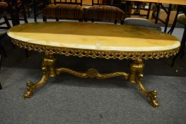 An onyx and brass oval coffee table.