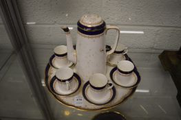 A Royal Worcester porcelain coffee set with tray (faults).