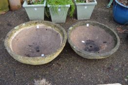 Two reconstituted stone circular planters.