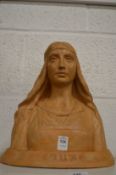 Terracotta sculpture depicting the bust of a young lady.