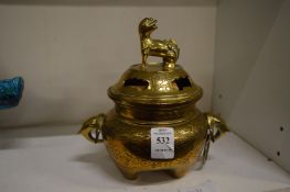 A Chinese bronze censer with engraved decoration.