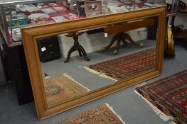 A large oak framed mirror.