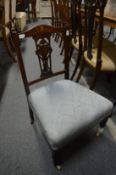 A late Victorian inlaid rosewood occasional chair and a pair of mahogany high back chairs.