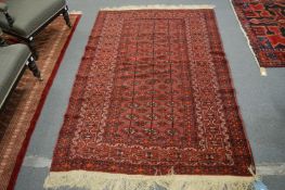 A bokhara rug, 199cm x 130cm.