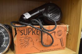 An L G Hawkins Supreme bakerlite hairdryer with original box.