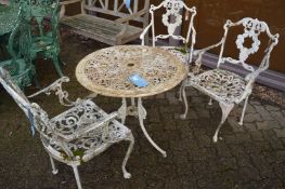 White painted aluminium patio table and three chairs.