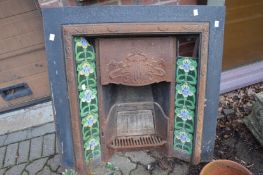 An Art Nouveau cast iron fireplace.