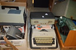 Old photographic/cine equipment, a typewriter and a sewing machine.