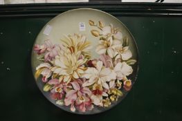 Continental porcelain charger decorated with flowers.
