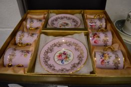 A Hammersley boxed set of six porcelain coffee cups and saucers with floral and gilt decoration.