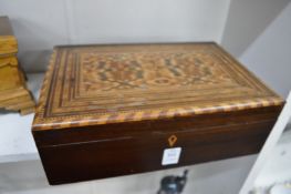 An inlaid mahogany box.