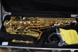 A Selmer Prelude saxophone with stand.