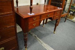 A Victorian mahogany side table with five small drawers.
