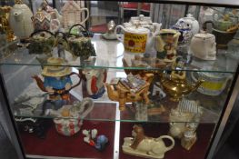 A collection of novelty teapots.