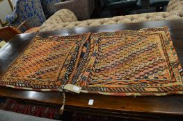 A Persian saddle bag and a Persian bag.