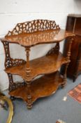 A good Victorian figured walnut three-tier whatnot.