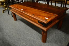 An Eastern hard wood rectangular coffee table.